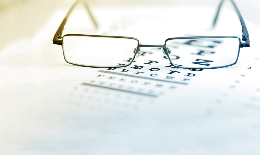 Glasses and an Eye Exam Chart